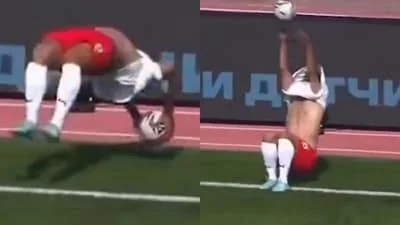 Football's wildest throw-in? Defender somersaults over ball before launching